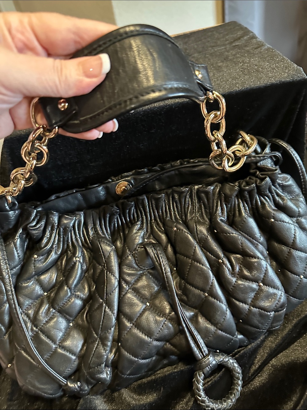 BCBG MAXAZRIA soft leather shoulder bag with gold hardware and studs. quilted